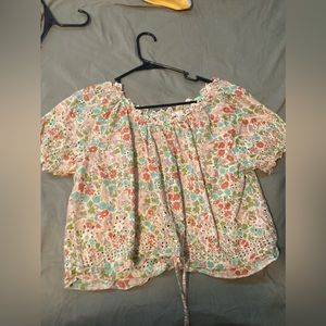 floral top with multiple colors.